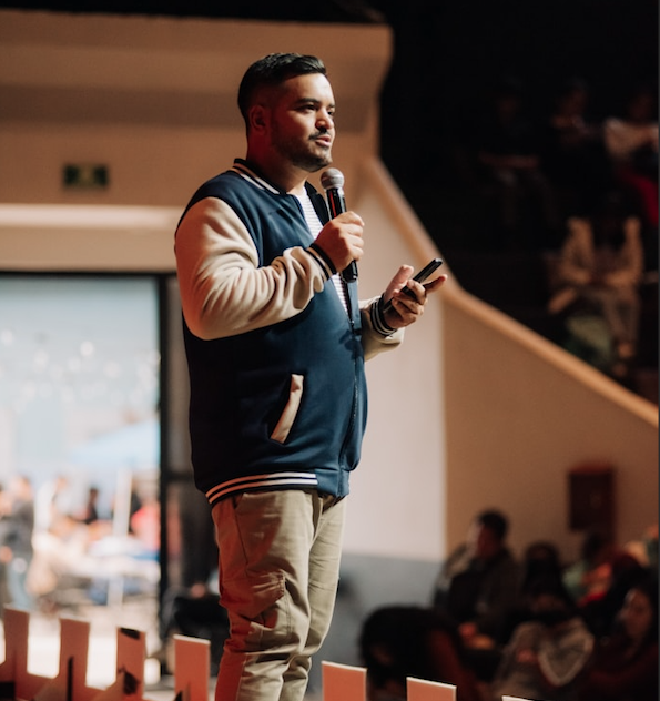 man speaking with a microphone